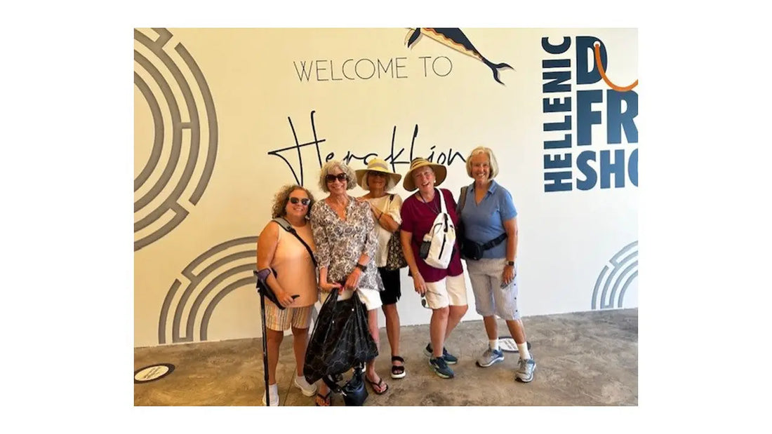 Five Women Posing in Front of a Wall with Images