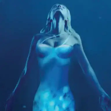 Ethereal female figure with head tilted back, bathed in blue light.