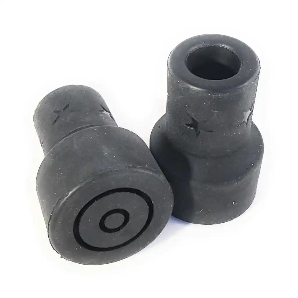 Pair of black rubber crutch or walking stick tips with circular grooved bases.